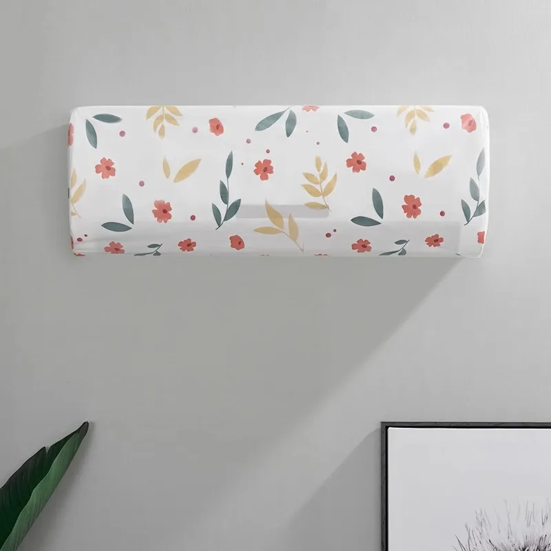 Housse anti-poussière à motif floral posée sur un split mural
