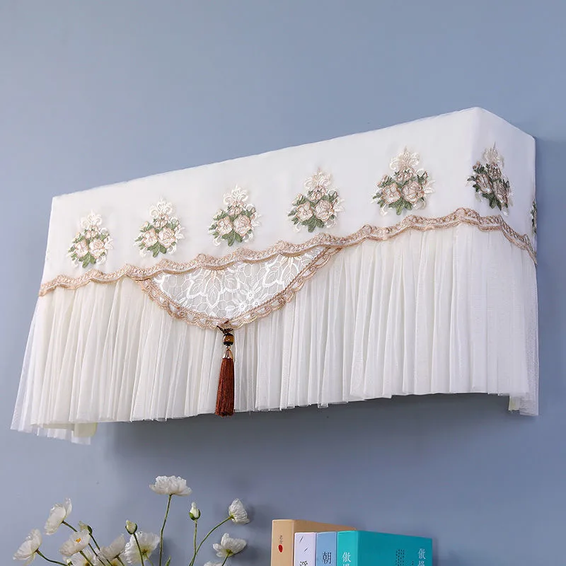 Housse en dentelle blanche couvrante sur un split mural